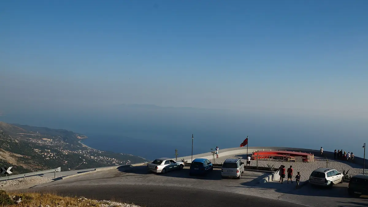 Cars at the Llogara pass viewpoint above the Albanian Riviera