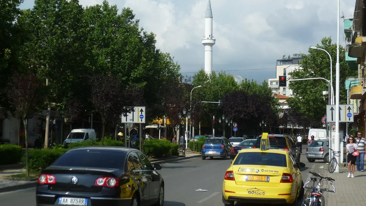 A yellow taxi on Rruga e Kavajës in Tirana